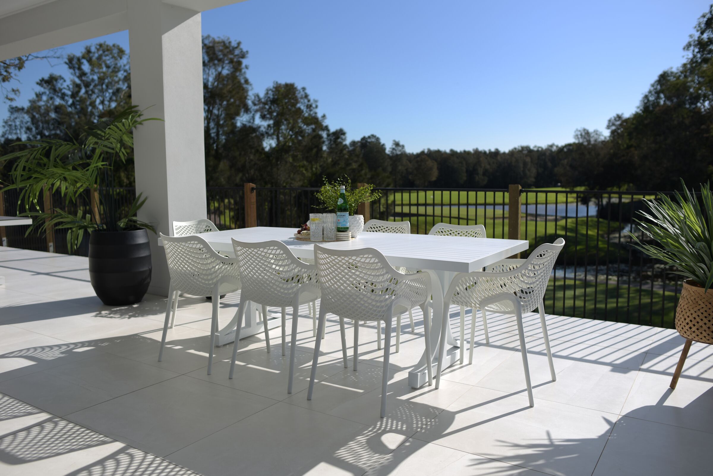 White Roma XL Bergen outdoor dining setting on a sunlit alfresco terrace