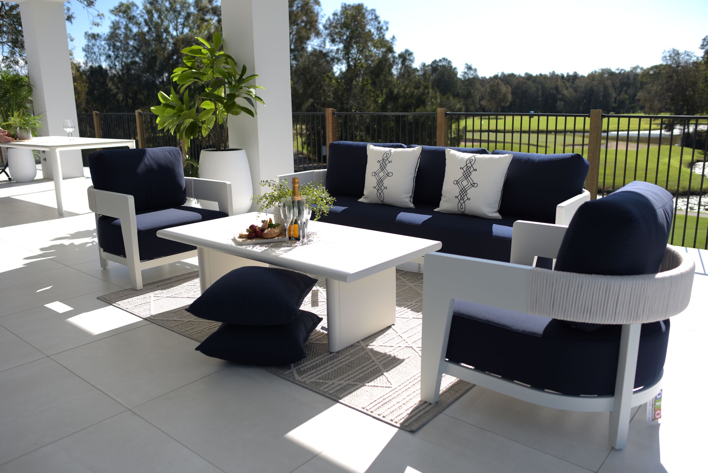 Marina Rope outdoor lounge setting with navy cushions on a sunny alfresco terrace